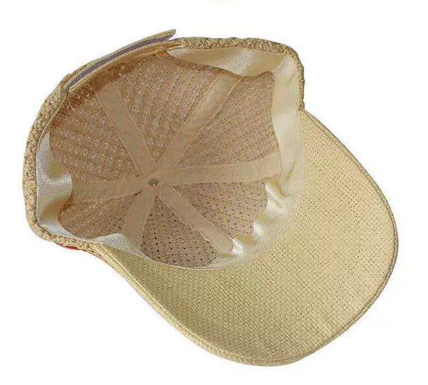 Beige straw cap with mesh back on a white background