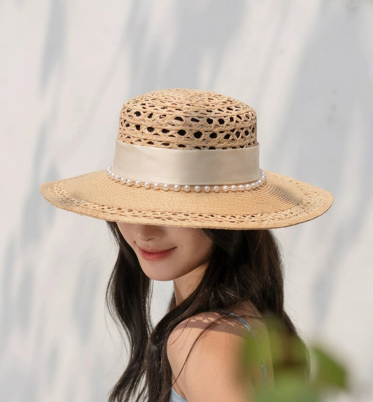 Woman wearing a straw hat with a blurred background